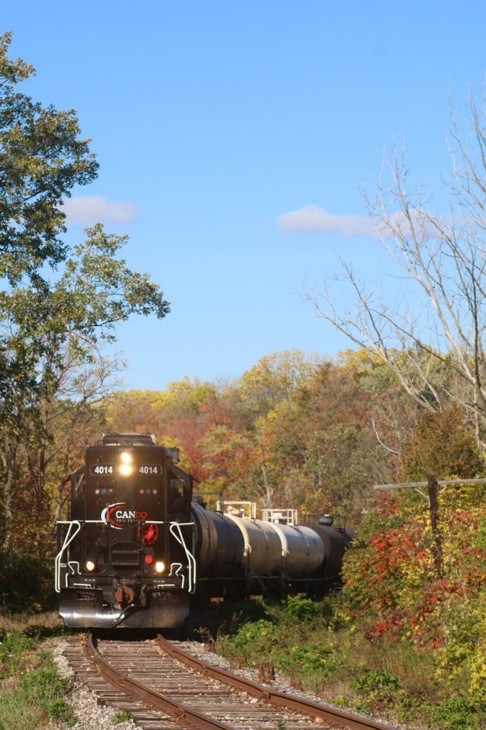 A splash of fall colour covers the landscape at Churchille on Brampton's west side, as the OBRY southbound trundles by, while housing developments are creeping closer, there is still some countryside left along the Credit River here.