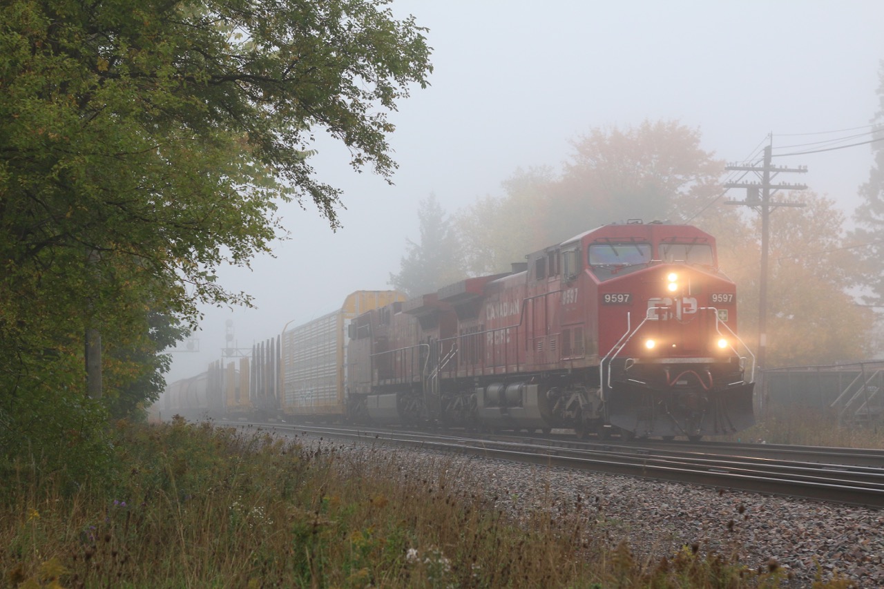 In the autumn you quickly learn to take the good with the bad as nice days are typically outnumbered by the gloomy days. a couple of stormy days can easily strip the trees of all their fall colours. Thankfully the fog can often bring dreary photos to life and that's what I was hoping for this morning as CP 234 got closer to me at Ontario Street in Streetsville. I guess I really can't complain considering how amazing this summer has been :)