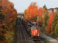 The sun has broken through a gap in the changing colours of a group of trees east of the station in Georgetown highlighting the nose of borrowed CN SD75 #5800. The unit is now on loan to the Goderich-Exeter replacing one of their SD40s, out for repairs. A few weeks earlier the GEXR was borrowing a Dash-9 from CN. the year 2016 has been a rough year for the GEXR as far as motive power goes, with a number of units having mechanical issues, some of which have left the property for major overhauls, leaving the railroad very strapped for power.