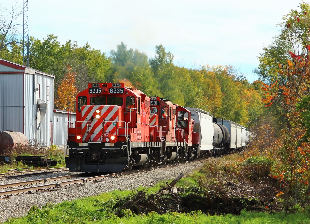 A trio of GMD power from the 1950's in GJR 8235 (1958), GJR 1591 (1954) and GJR 1210 (1958) trundle their way through the village of Moffat on their way to Guelph.