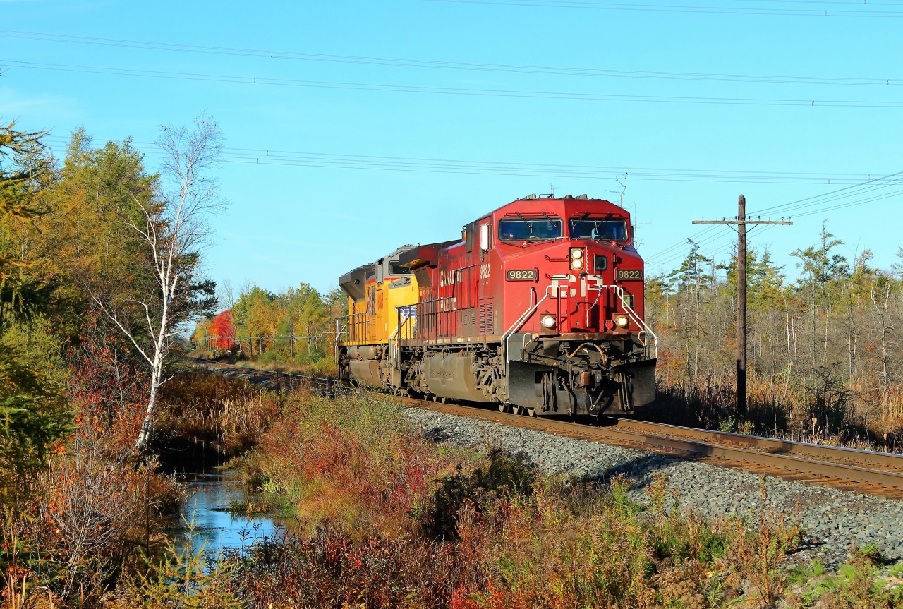 After many delays and a lot of time waiting, I was a little disappointed to see CP 9822 running light power with UP 8663 but the short train showed more of the fall colours of the area.  I wasn't in the rain for a change and it was a nice sunny, warm fall day so it was all good.