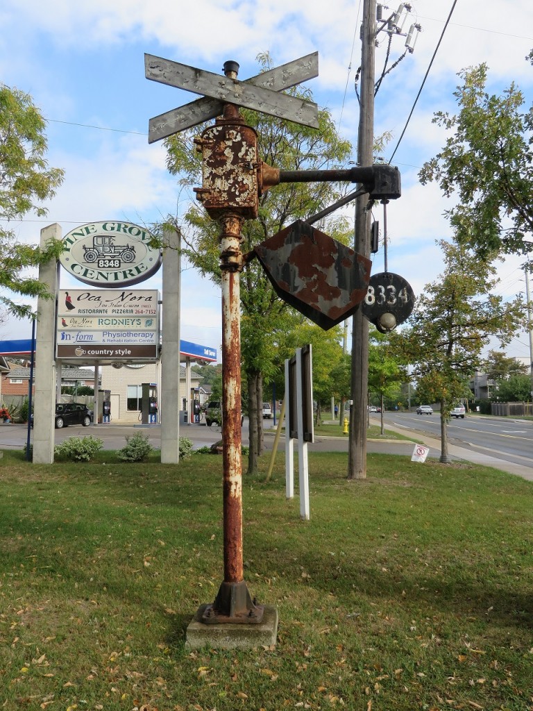 Built to last. This wig wag signal has been on the side of Islington Avenue a long time. I recall seeing it about 35 years ago when there was nothing around and thought it was long gone. Today it is surrounded by development but it is in surprisingly good shape. There are redevelopment signs on the site, so I doubt it will be there 35 years from now.