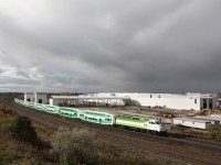 After a complete closure of all tracks between Durham junction and Guild wood stations, GO transit hurries to get trains back on scheduled.  Here 615 east passes the new Whitby facilities in between rain showers with trains running about every 7 minutes apart. An amazing amount of progress has taken place over the past year. Hydro, Bell and a natural gas contractor are now hooking up there services within the steal plant to by pass Hopkins street.