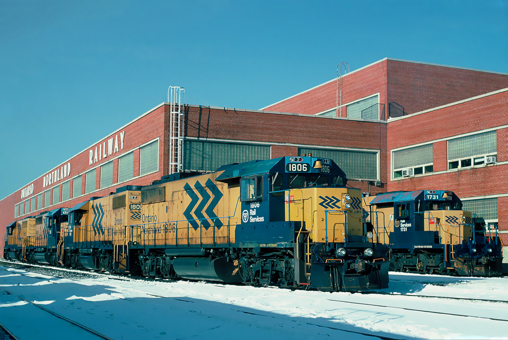 Ontario Northland Railway diesel repair shops with two GP38-2s, and three SD40-2s sitting in the winter sun. December 26, 1995.