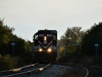 On a gorgeous fall evening, OSR 383 and 378 pass through the town of Belmont on its way back with freight from St Thomas.