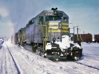 QNS&L's passenger train with in the lead GMD SD40 204 and GMD GP9 134 will be leaving Schefferville Station for the 357 mile trip South to Sept-Îles, Québec Jan.07, 1970.