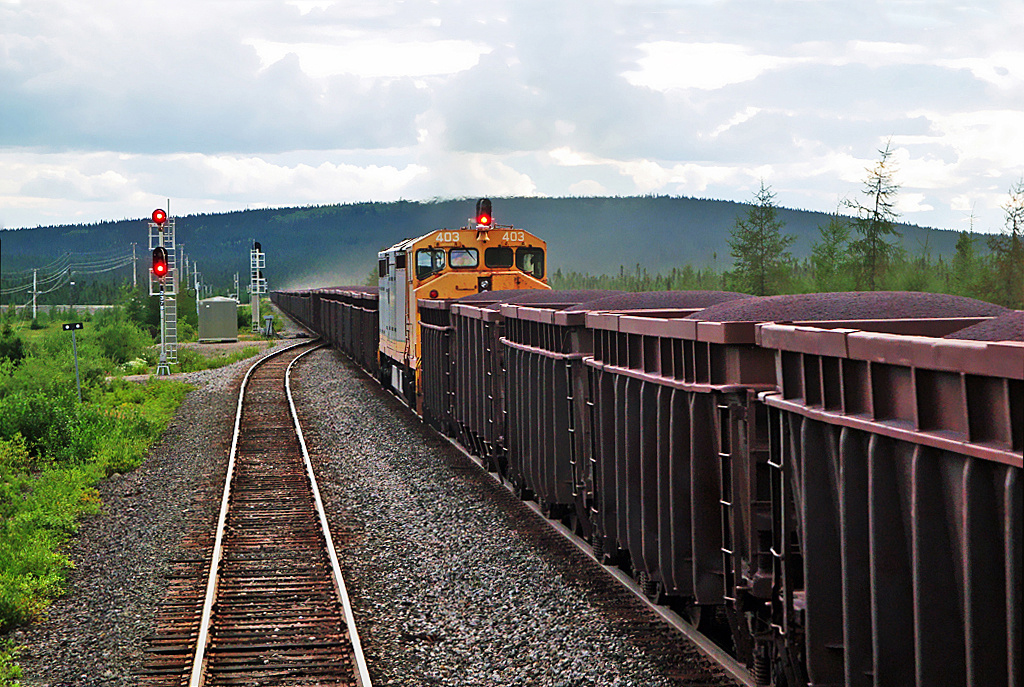 QNS&L GE C40-8M No.403 working mid-train helper on a southbound iron ore train at Oreway, Labrador mile post 186.6.
