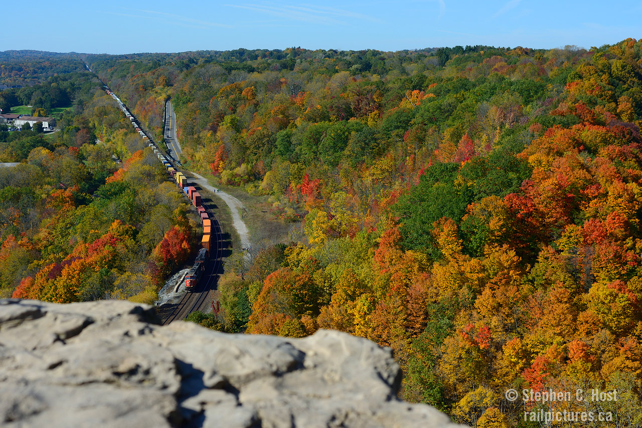 Tens of thousands of years ago, retreating ice-age glaciers carved the land creating the Niagara escarpment, and I'm sitting on the edge of it all on a beautiful fall day, I witness two trains almost side by side heading down the hill with foliage at peak. A beautiful place for a visit and last years colours were the best in years. If anyone plans to go: The place is called Websters Falls Conversation Area and you can hike in from the bottom or the top, but be warned: The peak is over-run with tourists, and it is only getting worse. And I'm not kidding, thousands of people on any given day during fall peak colour season. For best results, if sunny, the light is good from sunrise to 1030, after which it starts to become backlit for trains. Sometimes you get eastbounds, sometimes you don't, but go to enjoy, you won't be dissapointed.