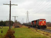 Wrong leader. I seem to have a knack of running into SD70/75i's on CN in this period, and to me they were the GEVO of their day. Boring, I preferred the turbocharged 645's of 5316 trailing. Train 582 is heading south on the Talbot sub headed for St Thomas - back when 582 used six axle power and they ran two jobs per day to St. Thomas from London. Predictable as it was, 582 departed around noon usually for St Thomas and the evening job was usually just after dark.