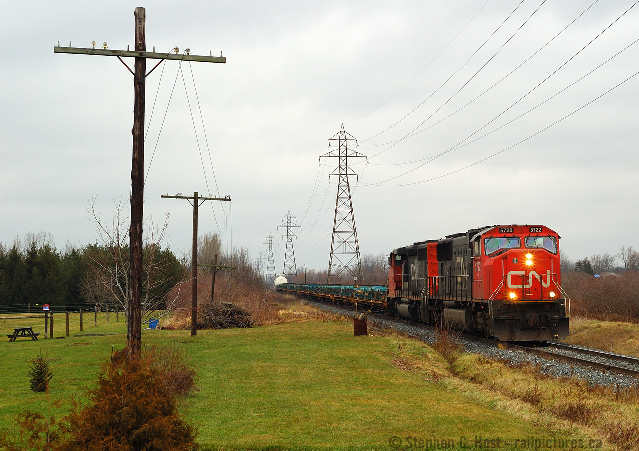 Wrong leader. I seem to have a knack of running into SD70/75i's on CN in this period, and to me they were the GEVO of their day. Boring, I preferred the turbocharged 645's of 5316 trailing. Train 582 is heading south on the Talbot sub headed for St Thomas - back when 582 used six axle power and they ran two jobs per day to St. Thomas from London. Predictable as it was, 582 departed around noon usually for St Thomas and the evening job was usually just after dark.