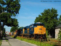 GEXR in Summer 2004 could be described as follows: Shiny. Most days new engines from EMD would end up on the point of 431 and 432, mostly CSX SD70ACe's - but there were CN, BNSF and even Union Pacific ACE's all fresh from EMD London. (The UP run would happen AT NIGHT and only happened ONCE that I am aware of!). Living at Kent St at this time in my life had its benefits - close to downtown (bars!) and close to tracks. A few friends joined me beers in hand while we watched the train go by - and I was smart enough to take my camera out for one of my few actually half decent photos of these movements. The time was 17:50.<br><br>Rob Smith would certainly note - There was always a smoky joe on the train through Guelph - in this case an EMD employee who ALWAYS took his smoke break on cue for the ride down Kent St. EMD employees rode along as part of these tests which lasted from July 3 2004 into October 2004. A CN -M2 unit also tested to Toronto on GEXR in January 21 2006 so tests weren't exclusive to just the summer '04 period. There were also numerous tests between London and Stratford which I regrettably never went to see, someone will share here some day i'm sure :) The beauty of our hobby.