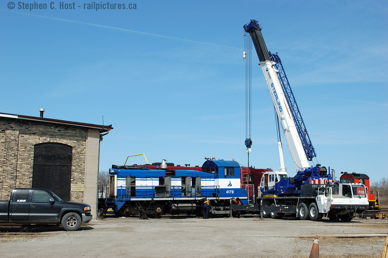 Taking a lift, changing trucks on NCLX 417B (yes "B") on this SW1500? (anyone care to comment on exactly what this locomotive is?) at Lambton Diesel Services of Sarnia.