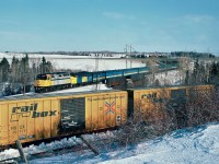  Three years old VIA Rail F40PH-2 No.6410 leading train 14 the "Ocean" near Bathurst, New Brunswick December 12, 1989.