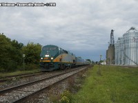 Thamesville has had claim on two historical moments - one of the more horrible train derailments to occur happened in this small farming community, as well most recently as of 2012 having lost it's station. Here, an evening train passes by the newly built silos belonging to Agris Co-op, just staying ahead of the rainstorm fast approaching in the distance.

For a photo of the station, you can view it here: <a href="http://www.railpictures.ca/?attachment_id=21337"> http://www.railpictures.ca/?attachment_id=21337 </a>