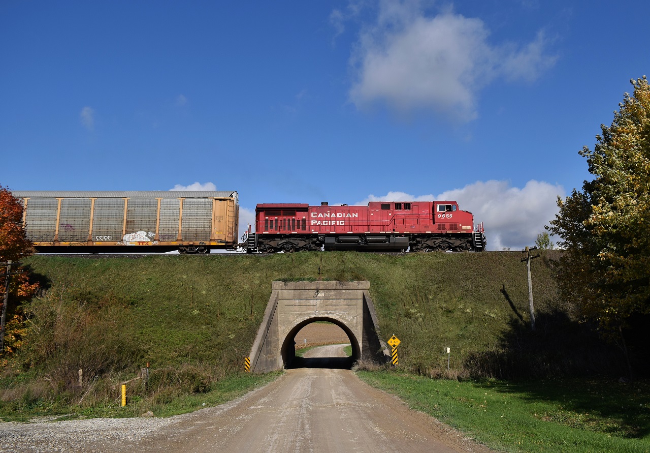 A solo CP AC4400CW is in charge of 244 as they pass over a neat old concrete bridge, made in 1909. They give a short blast of a beautiful Canadian K3 horn, as I'm busy taking pictures. There were no ES44ACs out of 2 CP trains I saw, not bad.