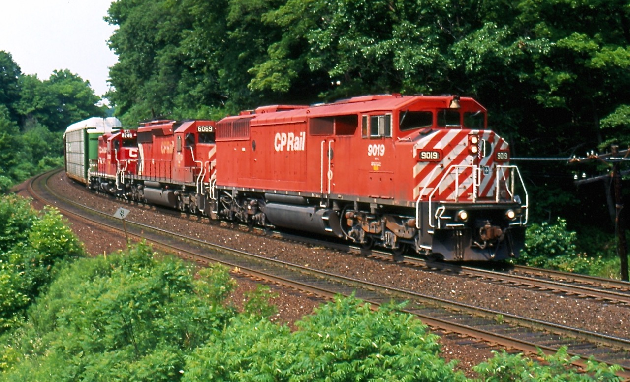 It was a nice morning for a hike, and as I had never walked in east of Guelph Line, myself and friend Brian Switzer decided today would be a good day to explore the area. We knew we had an eastbound heading our way so we found a small rock ledge about a quarter of a mile in, and set up for our shot. Soon a trio of now retired EMD products entered the view finder as they headed their train towards Toronto.