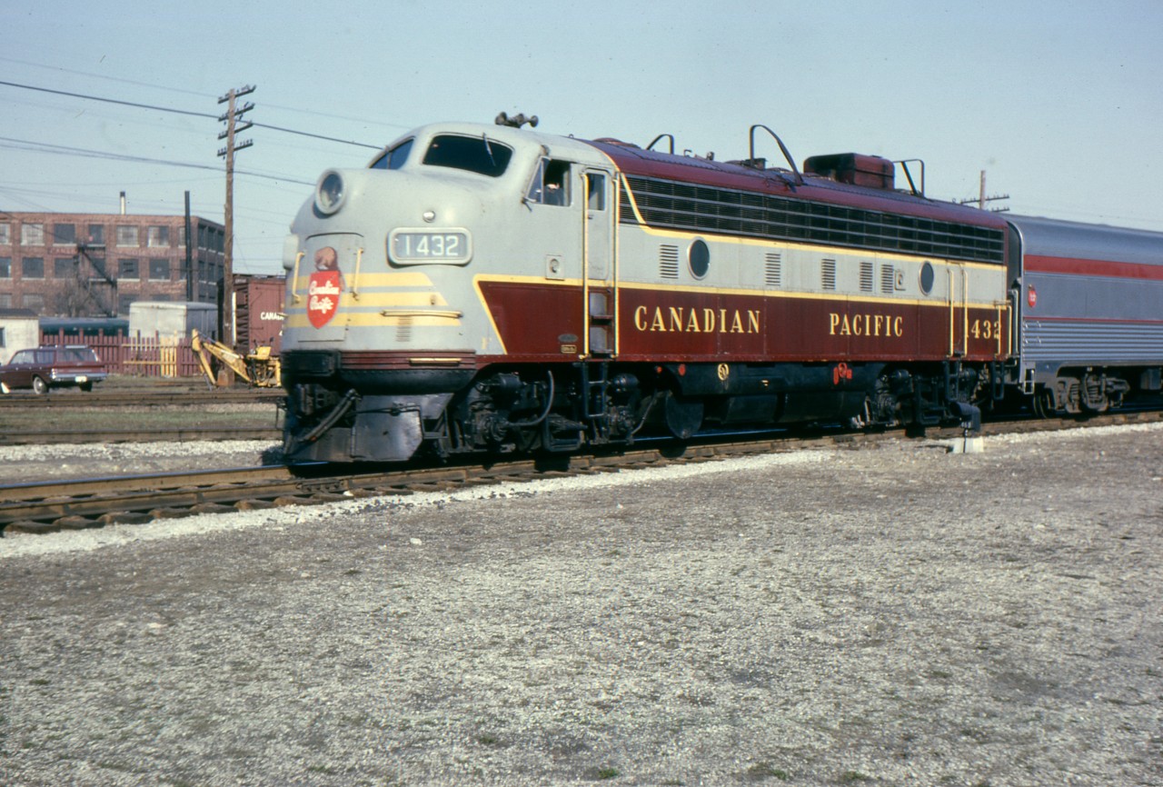 Normally an RDC run we see CP train 359 going 'around the horn' at West Toronto with FP-7 1432 and 6 cars,  on Friday April 17, 1964. The extra set of louvers ahead of the first porthole is a spotting feature for FP-9s but 1432 is unique as she was involved in a wreck and sent back to GM Diesel in London for rebuilding. GM used an FP-9 front end to make repairs.
