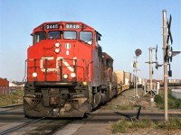 Train 201 crosses the level crossing at 50th Street in NE Edmonton. In a few years, a bridge would be built  and the road would pass under the tracks.