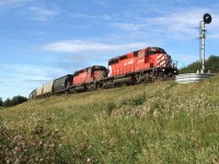 This is an eastbound CP train running on CN's mainline west of Edmonton.
I had seen CN trains detour CP in Kicking Horse Pass, but they had a CP pilot engine leading. Perhaps the rules had changed in this regard, or maybe the CN route is simply less demanding. Either way, it was a pleasant surprise to see this train.
It was a little odd that a lowly empty grain train was detoured, though. 