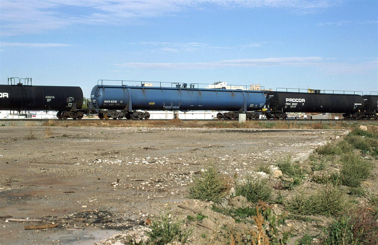 This is my first time noticing this type of tank car on train #550 to the Camrose Sub (and ultimately, the Brazeau Sub). I would later see these delivered to the then Union Carbide plant (Soon to be Dow Chemical) at Prentiss, near Red Deer. 
I can't be certain, but the car appears to be empty.