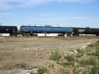 This is my first time noticing this type of tank car on train #550 to the Camrose Sub (and ultimately, the Brazeau Sub). I would later see these delivered to the then Union Carbide plant (Soon to be Dow Chemical) at Prentiss, near Red Deer. 
I can't be certain, but the car appears to be empty.
