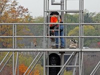 A CN Signals Maintainer changing out the bulbs on the west signal bridge at CN Snake.