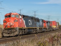 CN 149 blasts through the Bennett Road crossing in Bowmanville with a nice old Cowl leading the way.

CN2415, CN 5476, CN 2586

1600hrs 