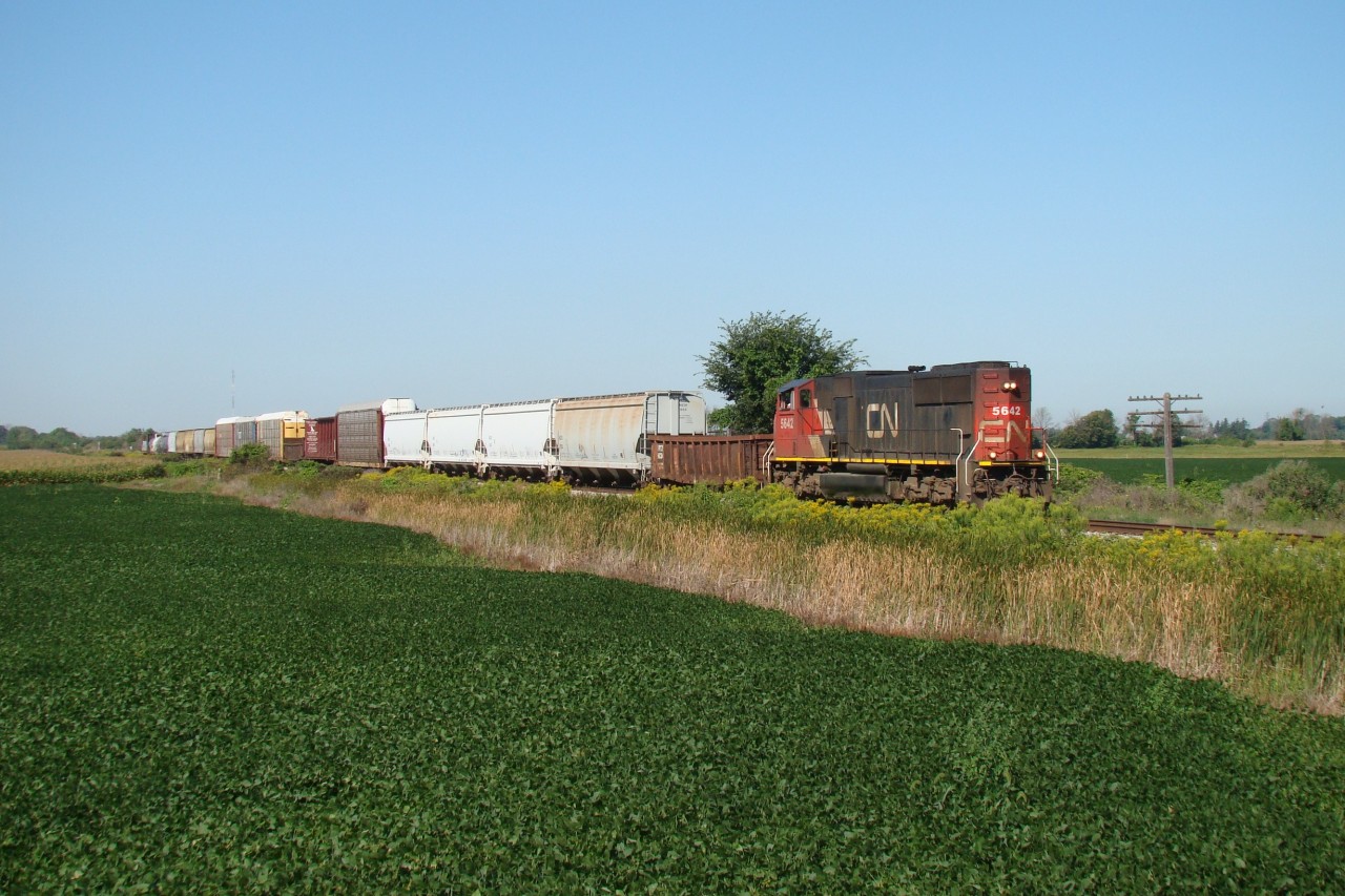CN 5642 has 23 cars in tow as he crawls down the CASO at tenth line, a few minutes before diverging off the CASO and onto the former CSX Sarnia Sub. This line was up for abandonment at this time and would ultimately be abandoned in May 2011.