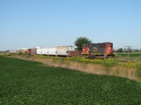 CN 5642 has 23 cars in tow as he crawls down the CASO at tenth line, a few minutes before diverging off the CASO and onto the former CSX Sarnia Sub. This line was up for abandonment at this time and would ultimately be abandoned in May 2011.