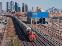 A solo ES44AC heads through Mimico with 75 empty multi's on the drawbar, the train will continue to Oakville and set off the whole train before continuing west to Aldershot to lift Toronto bound traffic for Mac Yard. 