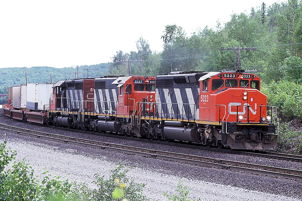 What was the hottest train on the railroad in those days (Montreal- Vancouver) heads west with a typically great lashup. Around this time, the SD50's and 60's had displaced some SD40-2's to eastern Canada, which pushed the GP40's off some of CN"s priority trains.