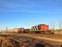 CN GMD1 #1408 is seen leading the Fort Whyte local towards Symington Yard on the CN Rivers Subdivision. The GMD1's are very rare to see operating these days, so seeing one leading is extra special.