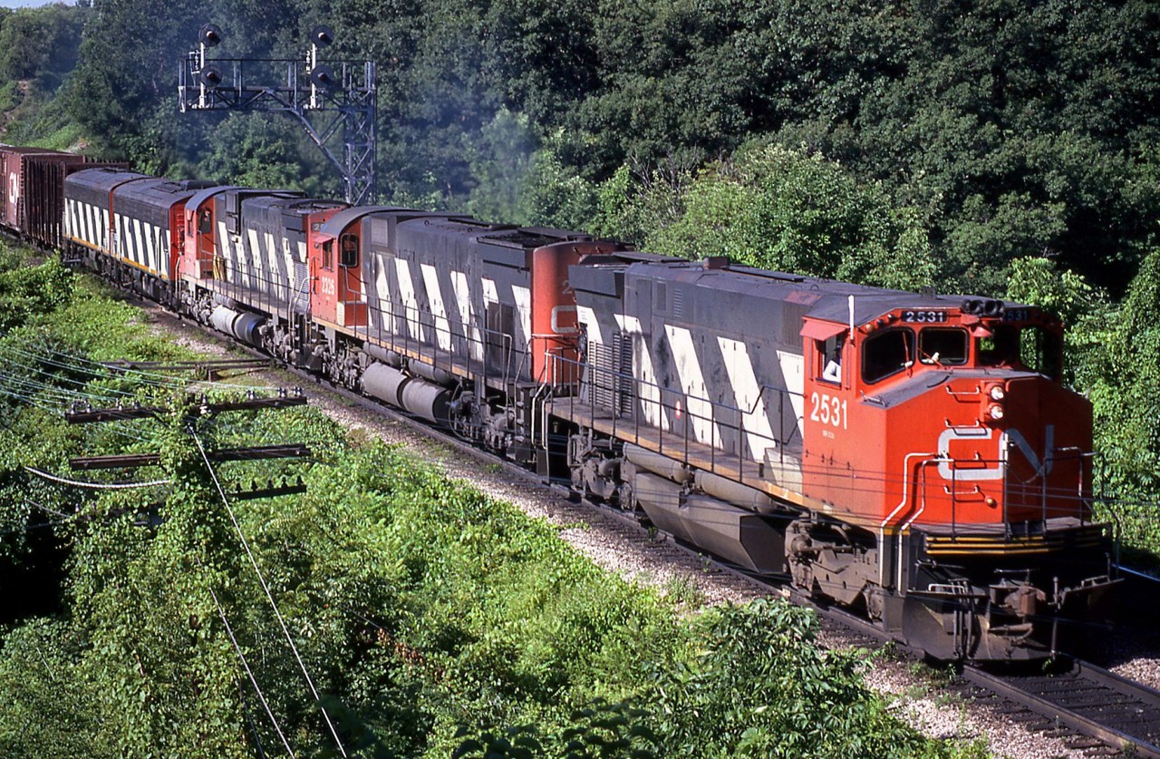 Some interesting consists resulted from the mixing of first generation and "modern" power. Pictured here, CN M420 2531 leads M636 2326, a 2000-series C630M, and two 9190-series F7B units on an eastbound through Bayview Junction.