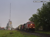 On an oddly, dreary yet drizzly cold October day, I was lucky enough to revisit one of my all time favourite spots for a little railfanning. My attempt - to Time Machine a photo by Arnold Mooney. Weather was not the only change of scene...gone were some trees, the station and maintenance shed, the platform. And of course, who could not notice that this stretch of the Strathroy Subdivision is now only down to a single track?
<br>
<br>
I did the best I could given the circumstances of the day. And all is not lost - the line seems to be as busy as it was when I was a 6 year old, living in nearby Petrolia...some 30 years ago, same with Arnold's photo. You can see his photo here: <a href="http://www.railpictures.ca/?attachment_id=24979"> http://www.railpictures.ca/?attachment_id=24979 </a>