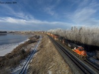 Eastbound Q198 rounds the curve at Mink Lake near Carvel Alberta
