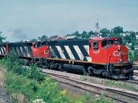 Eastbound CN Rail, with Bombardier units BBD HR412(W) 3585 and BBD HR616 2103 at Riviere-du-Loup, Québec August 10, 1992.