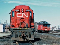 CN Rail MLW RS-18 No.3646 and CN caboose 79915 at Newcastle (now Miramichi), New Brunswick April 19, 1987.