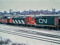 Canadian National GMD GP9 4529 with F7Au 9172 and CN Caboose 79215 at Ottawa, Ontario April 02, 1985