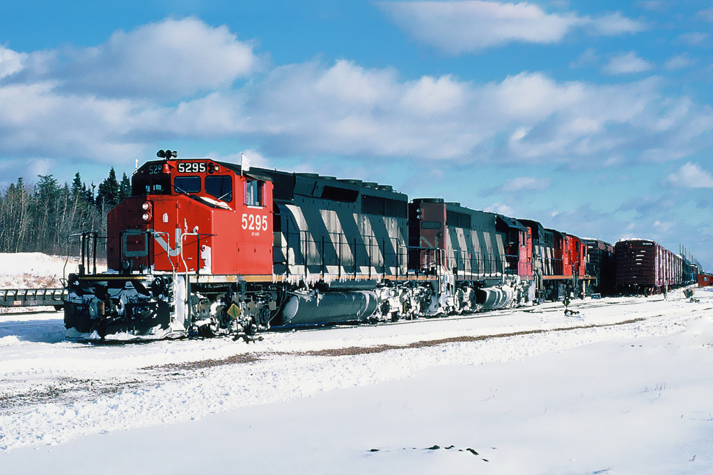 CN GMD SD40-2W 5295 with SD40 5064 and two MLW RS-18s at Moncton's Gordon yard. December 11, 1986.