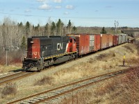  A very short E/B 402  Bathurst-Miramichi stretch with SD70I 5607 running long hood forward. May 03, 2011 