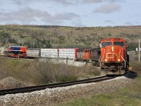 CN Rail SD75I No.5707 leads one of six GT38ACe exports to PTKA Sumatras, Indonesia; it was shipped from Electro-Motive London, Ontario en route to Halifax, NS for overseas shipment.