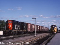 The crew on CN 7101 is taking a break from switching while Ontario Northland 121, the northbound Northlander, makes its station stop at CN's station in North Bay. 