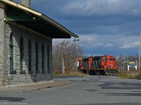 Having completed their work at Cameco, 518's crew reverse out of the spur behind the Port Hope depot and onto the south track of the Kingston Sub for the short run to the Cobourg yard. CN 4115 and 4125 power the train today. 1347hrs.