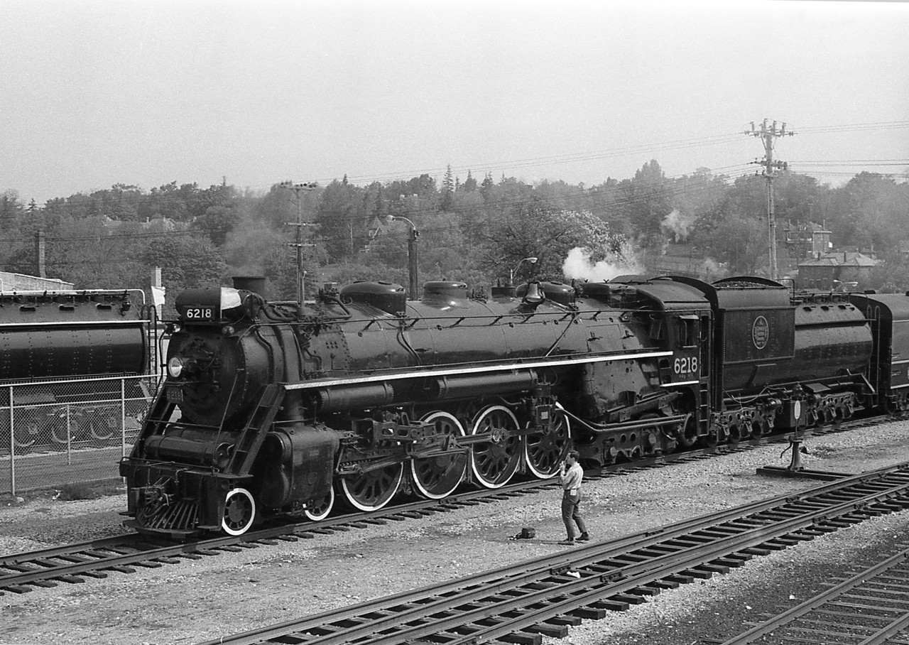 CN U2g Northern 6218 is shown arriving in Guelph near the station in 1969. It is passing sister U2e Northern 6167 (note tender in background), another former excursion steamer, that was on static display for years downtown just east of the station (until being <a href=http://www.railpictures.ca/?attachment_id=2905moved across the tracks in 2010). Today 6218 is also on static display, in Fort Erie.