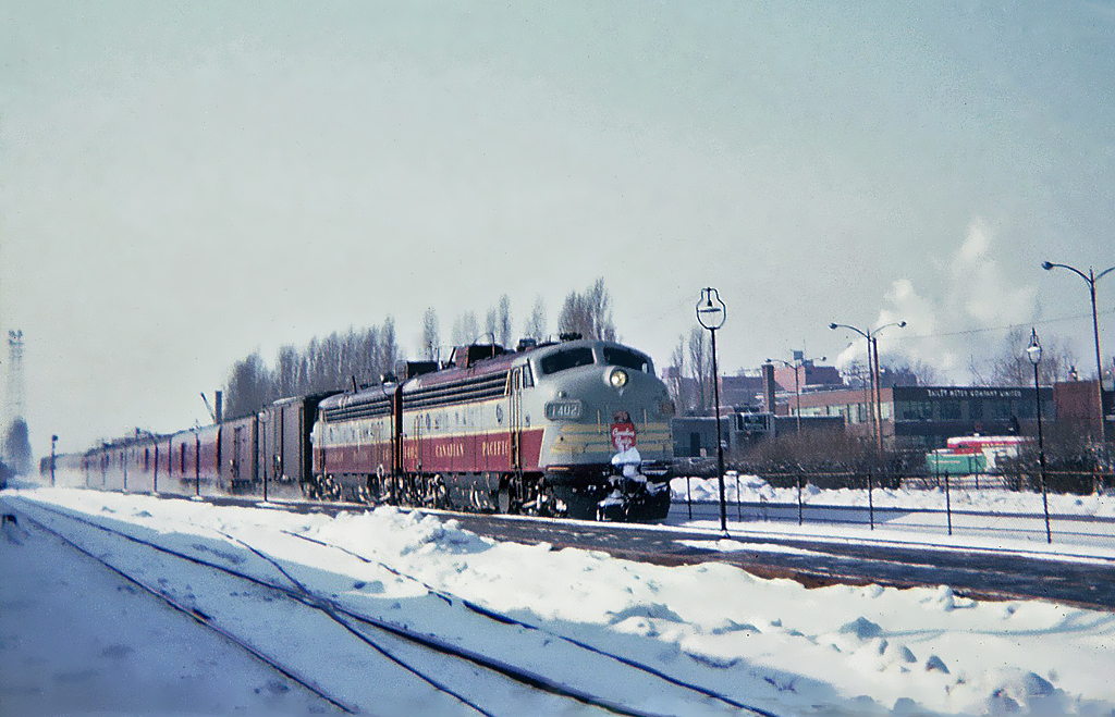 Canadian Pacific GMD FP7(A) 1402 on train 8 "The Dominion" is running off its last few miles to Montréal's Windsor Station on a cold February day, at Westmount station Feb. 16, 1965