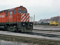 Canadian Pacific MLW C424 No.4230 with an eastbound C&O freight going by, October 30, 1985.