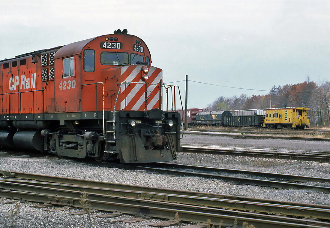 Canadian Pacific MLW C424 No.4230 with an eastbound C&O freight going by, October 30, 1985.