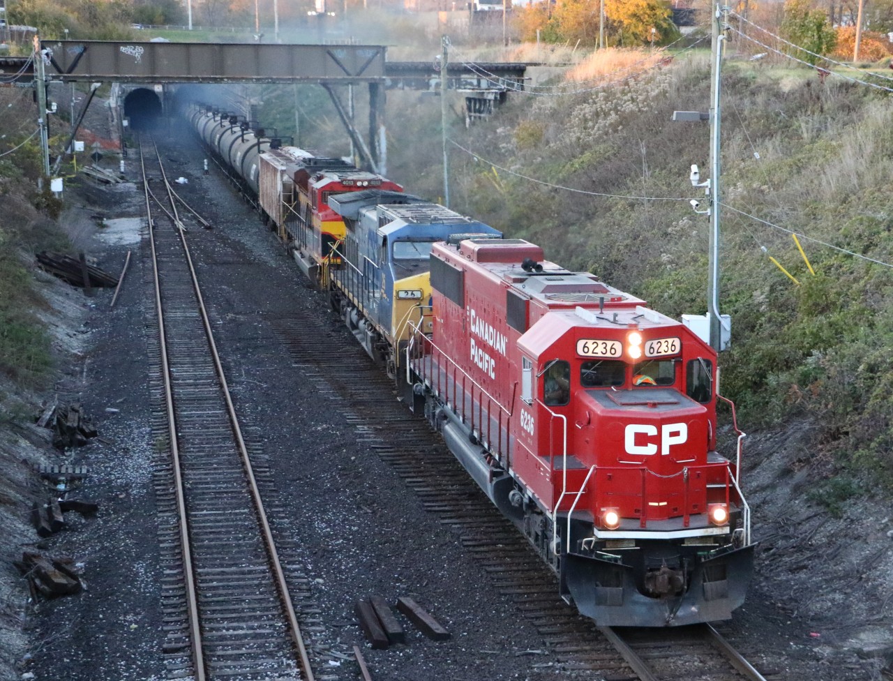 CP 646 with a nice lashup, has just emerged from the tunnel with the last bit of light left in the day.