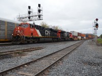 CN Q148 passes along side the new third track with the first gevo and the last gevo so far