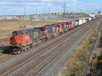 CN A435 heads West approaching the Bouvaird mile board with a pair of SD60s that are now out in service once again